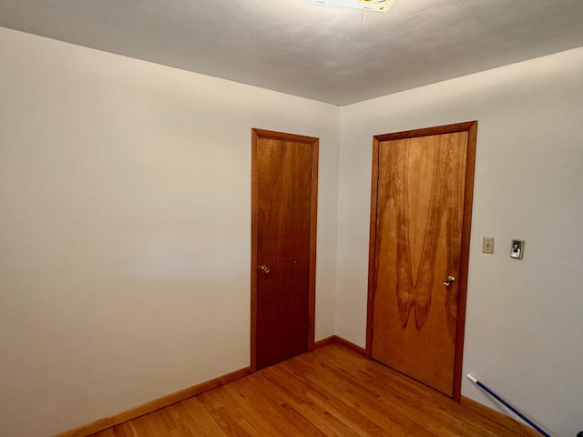 3390 Rector Rd, Morning View, KY 41063 - unfurnished room featuring baseboards and light wood-style flooring