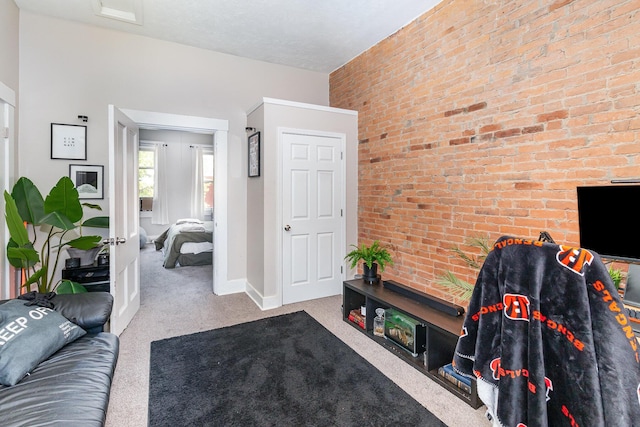 living room featuring carpet floors and baseboards
