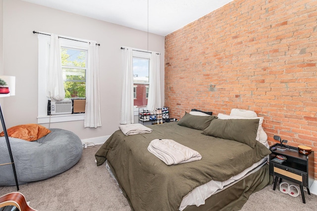 bedroom with carpet, cooling unit, and brick wall