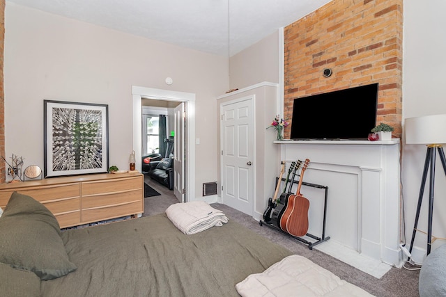 carpeted bedroom featuring visible vents
