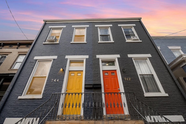 townhome / multi-family property with brick siding