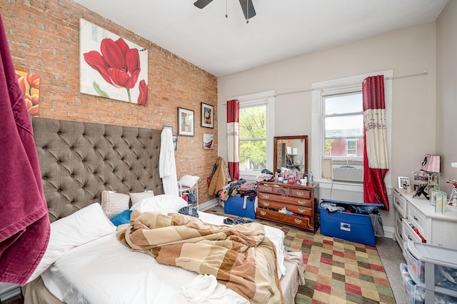 bedroom with carpet, baseboards, cooling unit, and brick wall