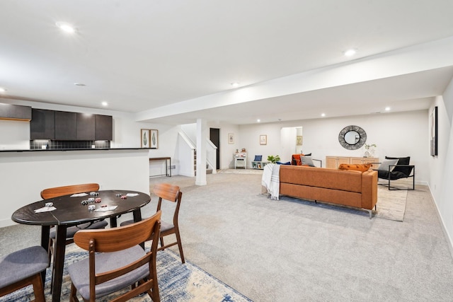 living room with light carpet, recessed lighting, stairway, and baseboards