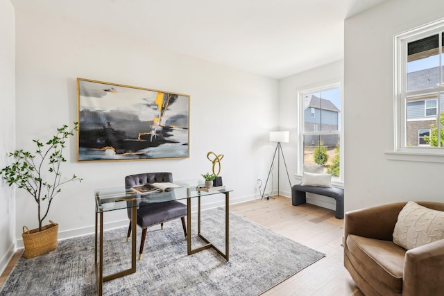 office space with wood finished floors and baseboards