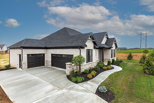 753 Man O War Blvd, Union, KY 41091 - view of property exterior with a garage, a yard, roof with shingles, concrete driveway, and stone siding