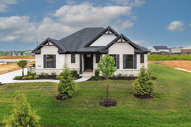 753 Man O War Blvd, Union, KY 41091 - view of front of house with brick siding, a front lawn, and roof with shingles
