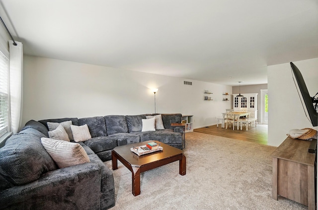 living room with light colored carpet