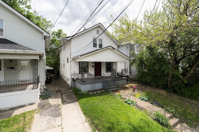 view of front of house featuring a front yard and a porch
