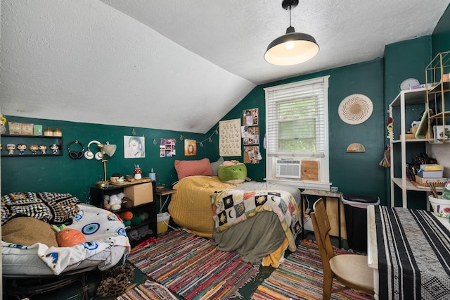 bedroom featuring lofted ceiling, a textured ceiling, and cooling unit