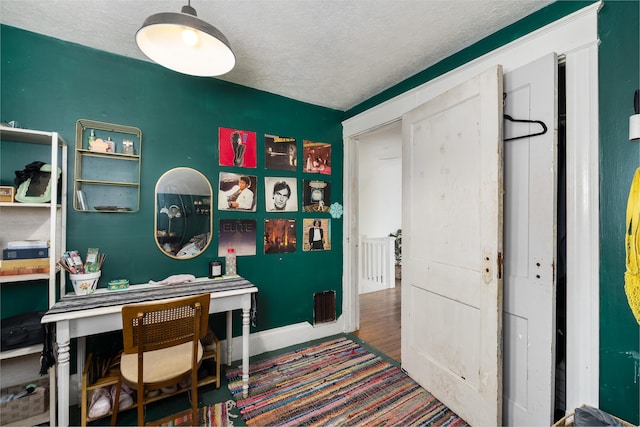 home office with a textured ceiling