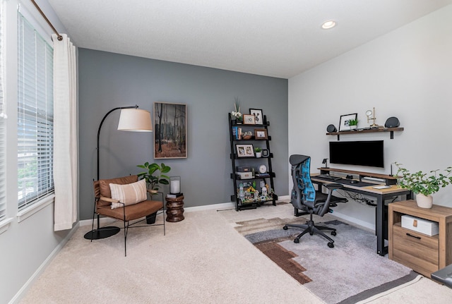 home office with carpet floors and baseboards