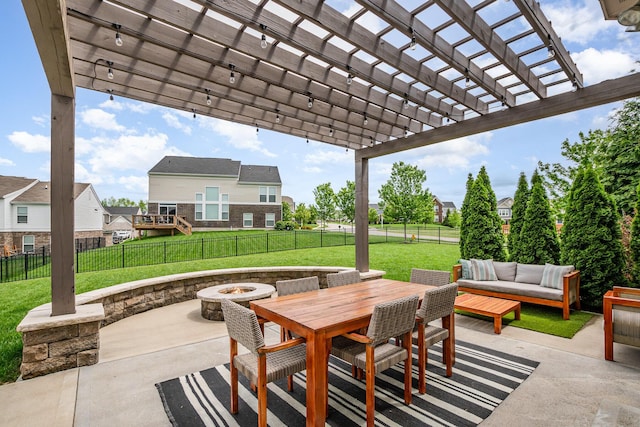 view of patio featuring an outdoor living space with a fire pit, a pergola, and outdoor dining space