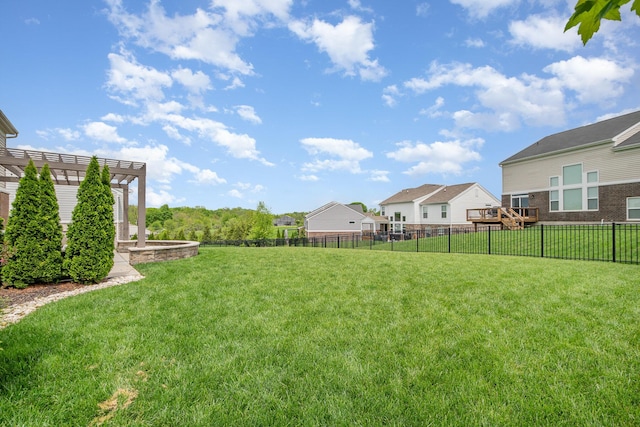 view of yard featuring a pergola and a residential view