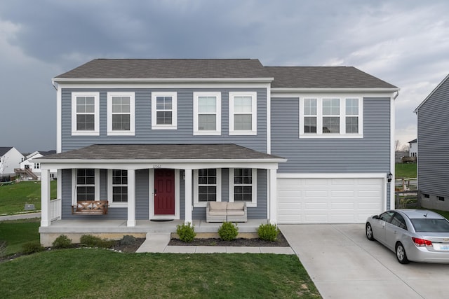 12062 Ambruzzi Dr, Walton, KY 41094 - view of front of property with a porch, concrete driveway, a garage, roof with shingles, and a front lawn