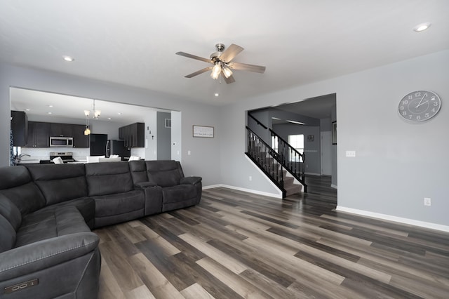 12062 Ambruzzi Dr, Walton, KY 41094 - living room featuring dark wood-style flooring, ceiling fan, stairs, baseboards, and recessed lighting