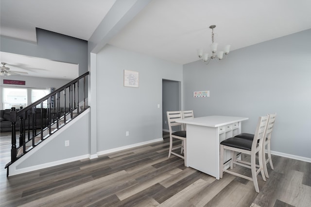 12062 Ambruzzi Dr, Walton, KY 41094 - dining space featuring dark wood finished floors, stairway, a chandelier, and ceiling fan