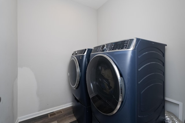 12062 Ambruzzi Dr, Walton, KY 41094 - washroom with washing machine and clothes dryer, wood finished floors, and baseboards