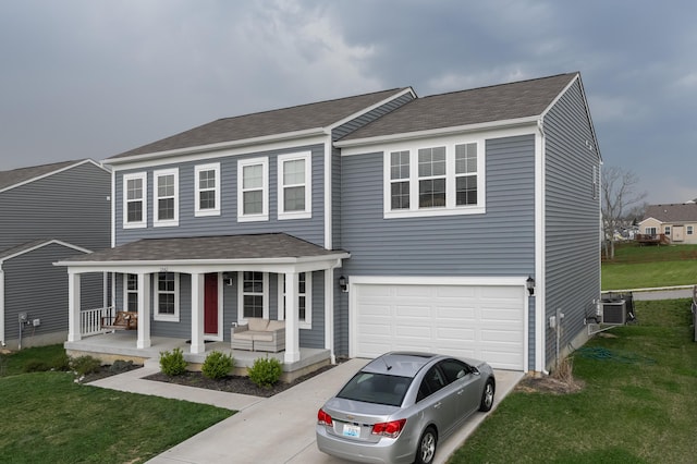 12062 Ambruzzi Dr, Walton, KY 41094 - view of front of house featuring a porch, driveway, cooling unit, a garage, and a shingled roof