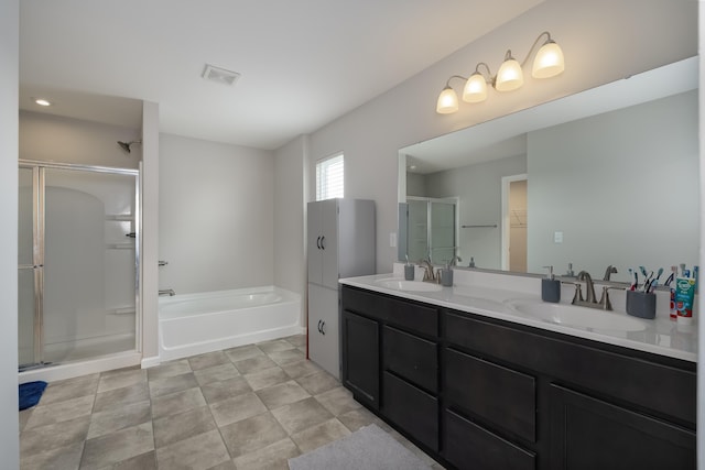12062 Ambruzzi Dr, Walton, KY 41094 - bathroom featuring a shower stall, a bath, double vanity, and a spacious closet