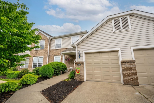 multi unit property with brick siding and driveway