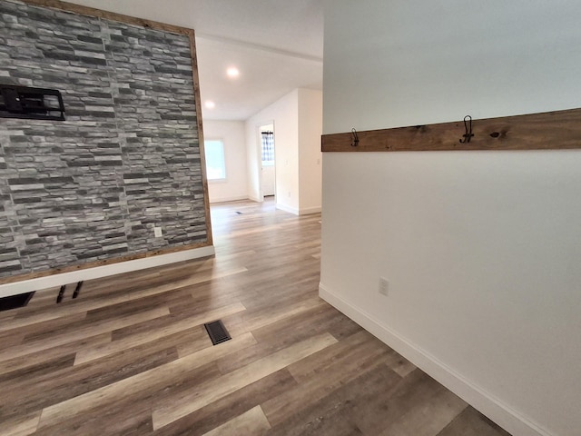 hall with baseboards, recessed lighting, visible vents, and wood finished floors