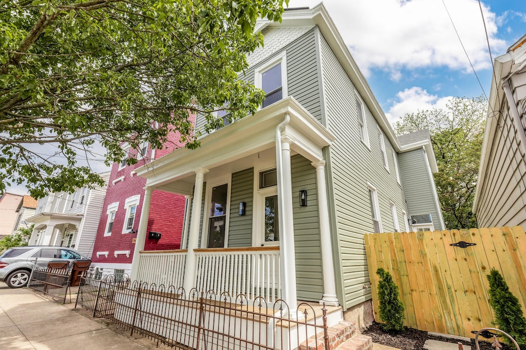 1716 Garrard St, Covington, KY 41014 - view of front facade featuring covered porch and fence