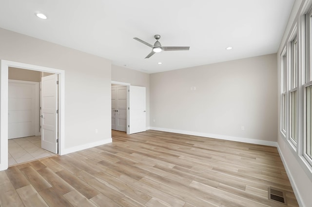 unfurnished bedroom featuring light wood finished floors, visible vents, baseboards, and recessed lighting