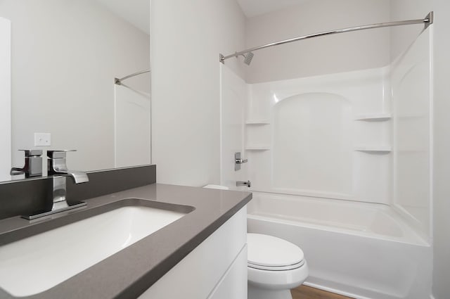 full bathroom featuring toilet, bathing tub / shower combination, and vanity