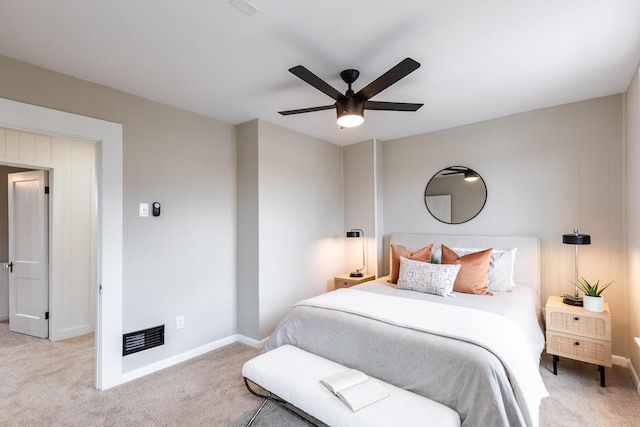bedroom with baseboards, a ceiling fan, visible vents, and carpet floors