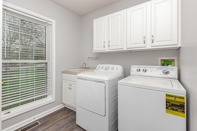 2600 Sunningdale Pl E, La Grange, KY 40031 - washroom featuring washer and clothes dryer, dark wood finished floors, cabinet space, and baseboards