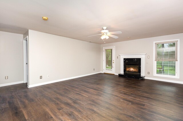 2600 Sunningdale Pl E, La Grange, KY 40031 - unfurnished living room with ceiling fan, dark wood finished floors, a premium fireplace, and baseboards