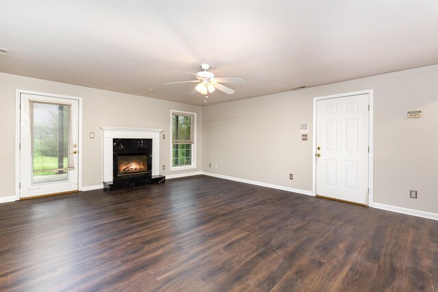 2600 Sunningdale Pl E, La Grange, KY 40031 - unfurnished living room featuring a premium fireplace, dark wood finished floors, ceiling fan, and baseboards