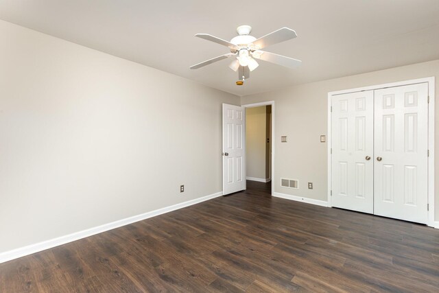 2600 Sunningdale Pl E, La Grange, KY 40031 - unfurnished bedroom with baseboards, dark wood finished floors, a closet, and a ceiling fan