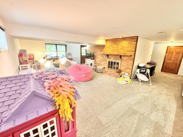 living room featuring a brick fireplace and carpet flooring