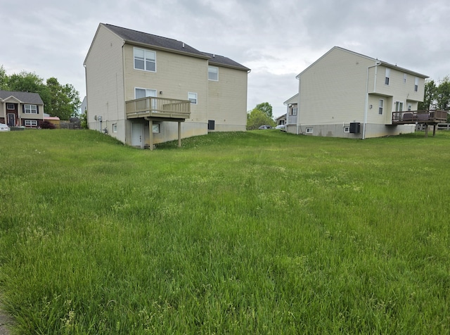 2964 Holly Hill Dr, Burlington, KY 41005 - rear view of property with a deck and a lawn
