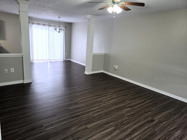 2964 Holly Hill Dr, Burlington, KY 41005 - spare room with ceiling fan with notable chandelier, dark wood-style floors, baseboards, and decorative columns