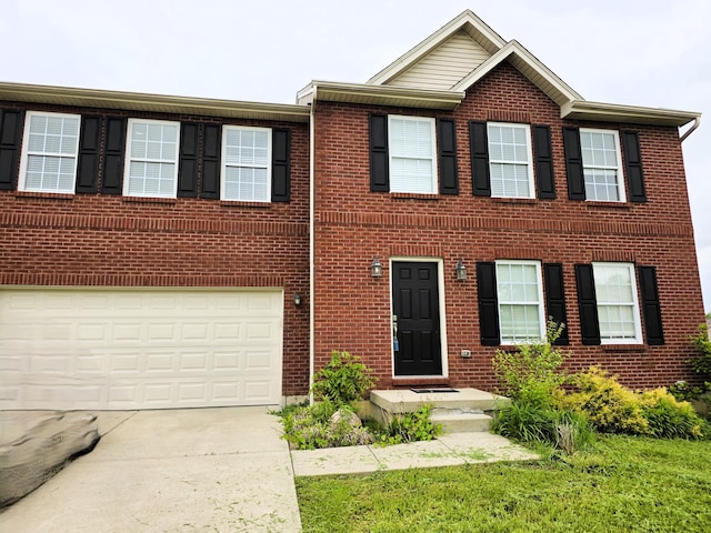 2964 Holly Hill Dr, Burlington, KY 41005 - view of front facade with concrete driveway, brick siding, and an attached garage