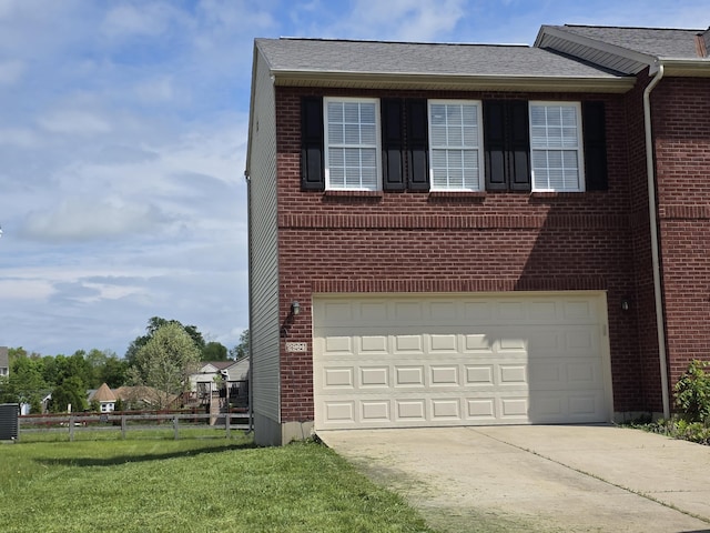 2964 Holly Hill Dr, Burlington, KY 41005 - view of property exterior featuring an attached garage, a yard, fence, brick siding, and driveway