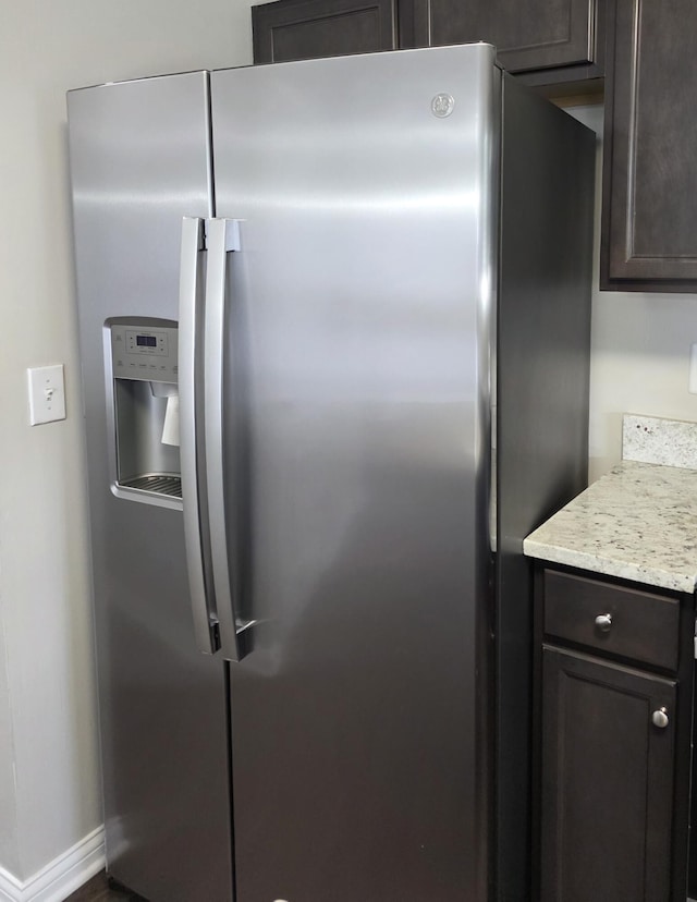 2964 Holly Hill Dr, Burlington, KY 41005 - kitchen with stainless steel fridge with ice dispenser and dark brown cabinetry