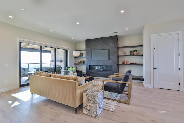 1200 Vistapointe Dr, Covington, KY 41011 - living area featuring light wood-style floors, recessed lighting, and a tile fireplace