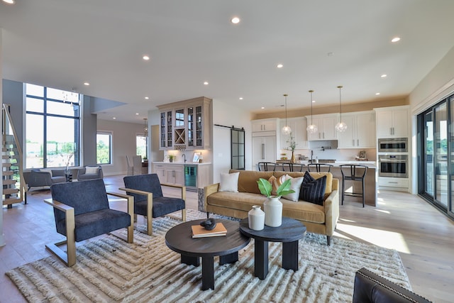 1200 Vistapointe Dr, Covington, KY 41011 - living room featuring healthy amount of natural light, light wood finished floors, wine cooler, and recessed lighting