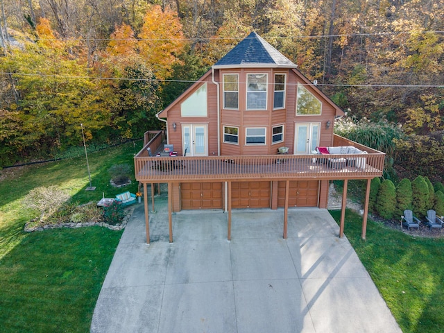 9500 Lower River Rd, Burlington, KY 41005 - rustic home featuring french doors, an attached garage, a deck, concrete driveway, and a front lawn