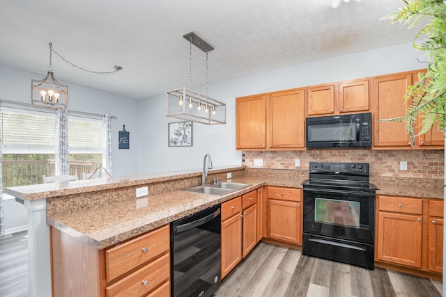 47 Nicole Dr, Independence, KY 41051 - kitchen with black appliances, a sink, a peninsula, and tasteful backsplash