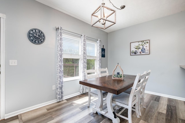 47 Nicole Dr, Independence, KY 41051 - dining area featuring a chandelier, wood finished floors, and baseboards