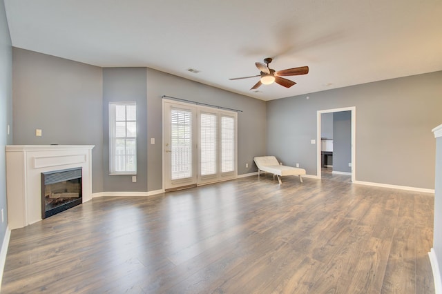 517 Ivy Ridge Dr, Cold Spring, KY 41076 - unfurnished living room with a fireplace, a ceiling fan, wood finished floors, and baseboards