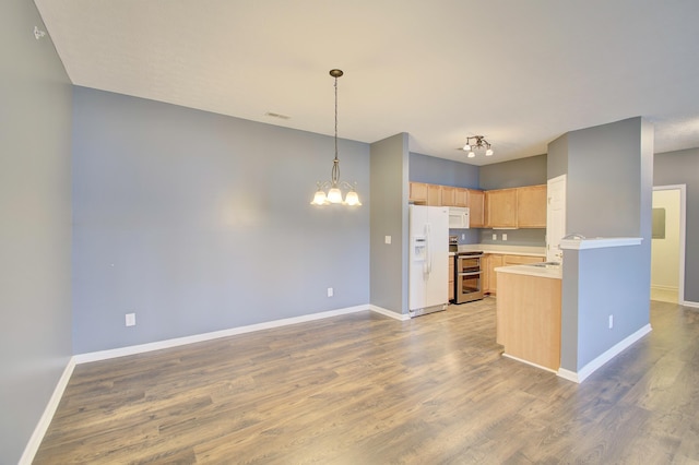 517 Ivy Ridge Dr, Cold Spring, KY 41076 - kitchen featuring white appliances, light brown cabinets, baseboards, light countertops, and a chandelier
