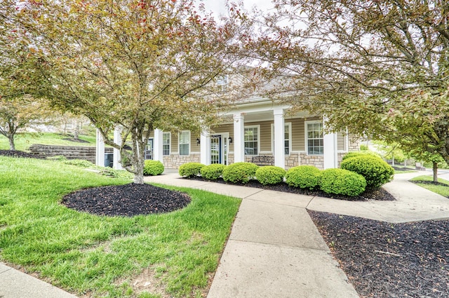 517 Ivy Ridge Dr, Cold Spring, KY 41076 - view of front of home featuring stone siding, covered porch, and a front lawn