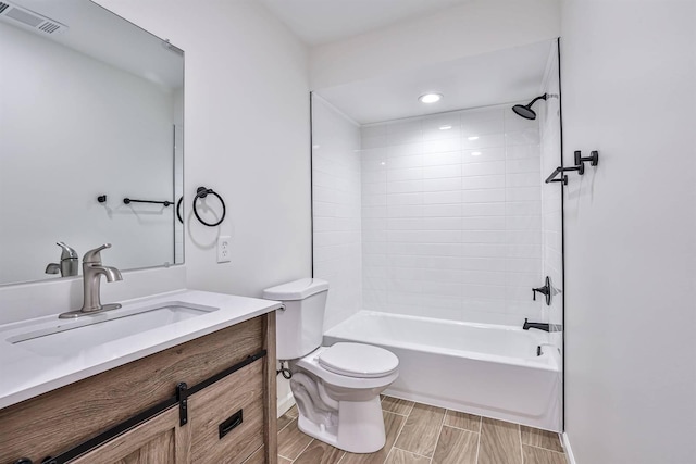 full bath featuring toilet, vanity,  shower combination, and recessed lighting