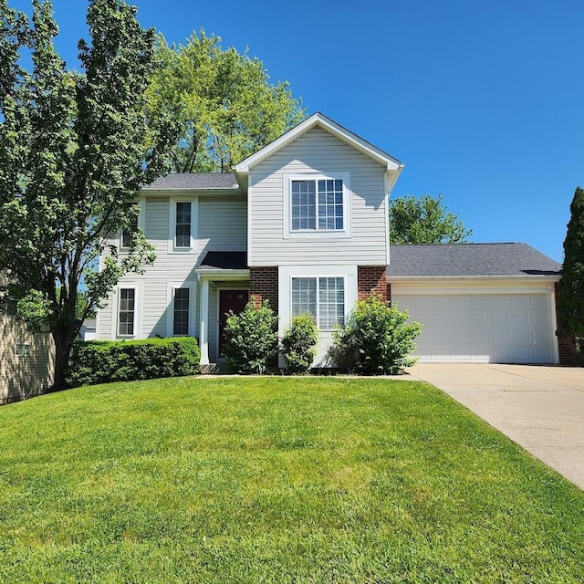 traditional-style home featuring concrete driveway, an attached garage, a front lawn, and brick siding