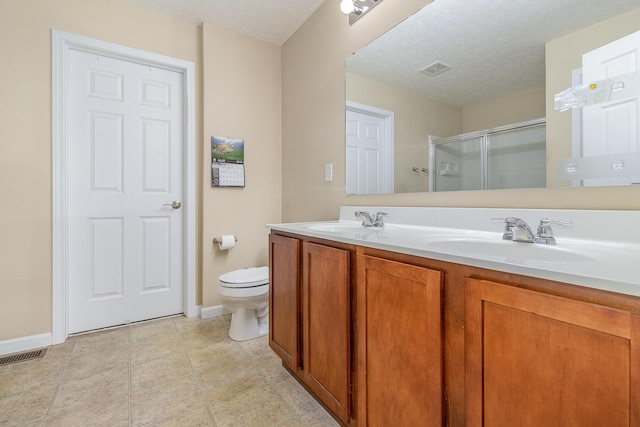 850 Stablewatch Dr, Independence, KY 41051 - full bathroom featuring a shower stall, double vanity, toilet, baseboards, and a textured ceiling